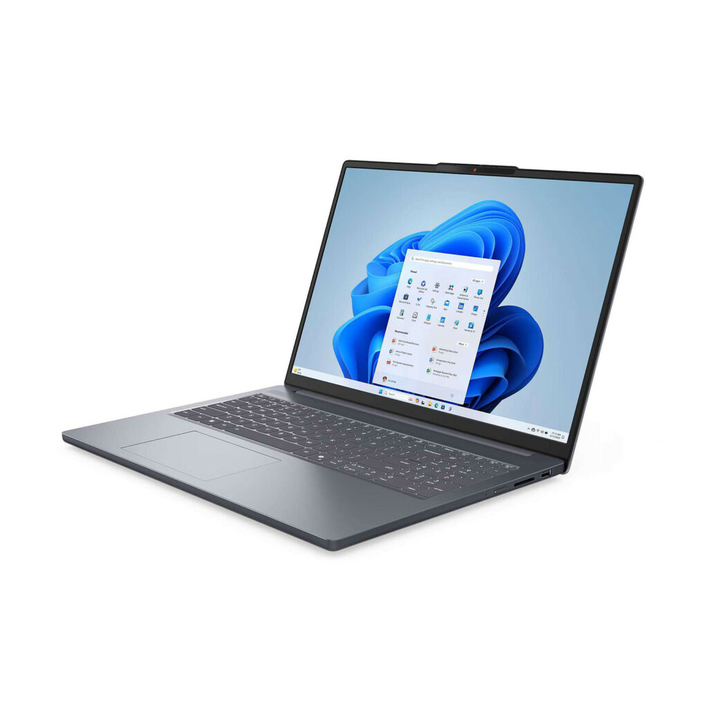 A sleek lenovo IdeaPad Slim 3 15IRH10 laptop with a large display showing the Windows 11 interface, featuring an elevated webcam and a modern keyboard design.